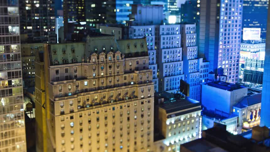 Illuminated apartment buildings and condos in downtown area at night
