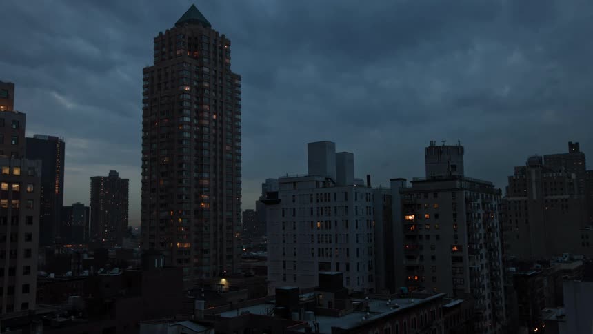 A time lapse of a city with lights turning on