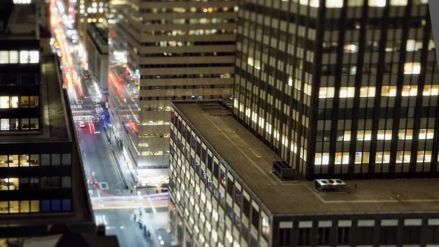 Time lapse view of traffic through a city is displayed