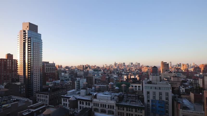 Aerial view of apartment buildings and skyline of new york city