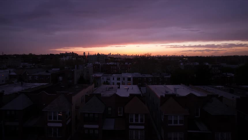 A time lapse of a sunset over a neighborhood