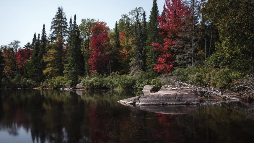A time lapse of a lake shows the water gradually drifting around over time