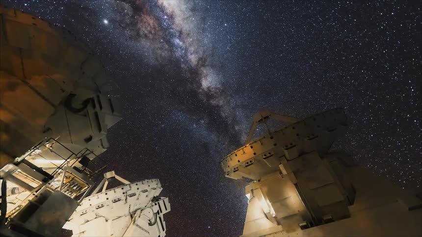 Space stations rotate in the night sky