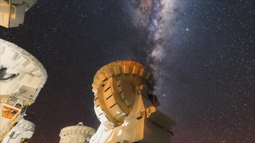 Timelapse of a couple telescopes following the stars on a starry night