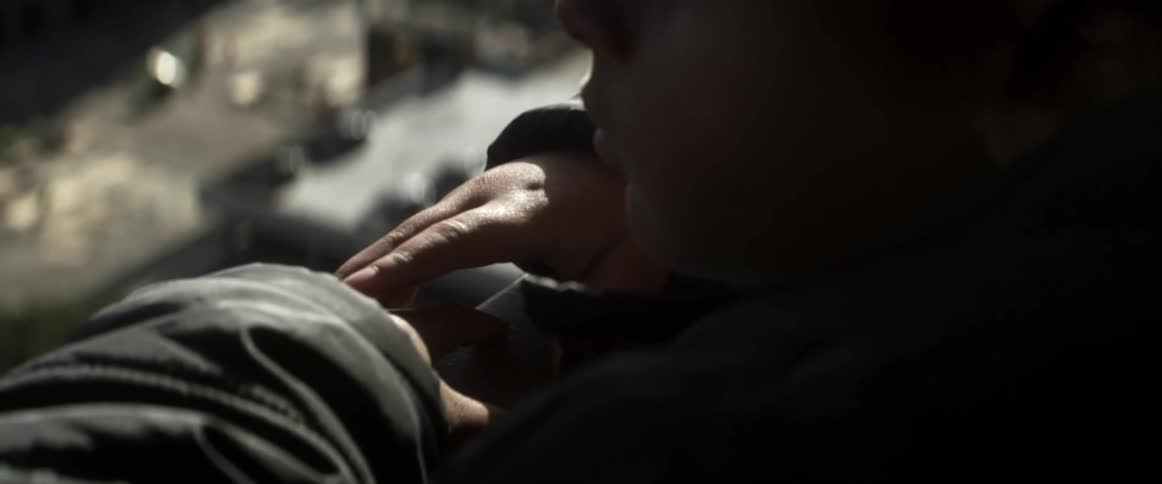 Close up view of a person standing outdoors at night