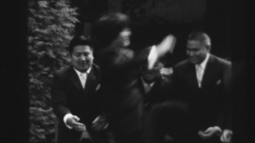 Man runs and jumps into friends outstretched hands
