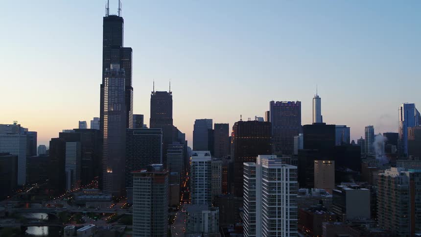 Aerial view of tall skyscrapers in the city skyline at evening