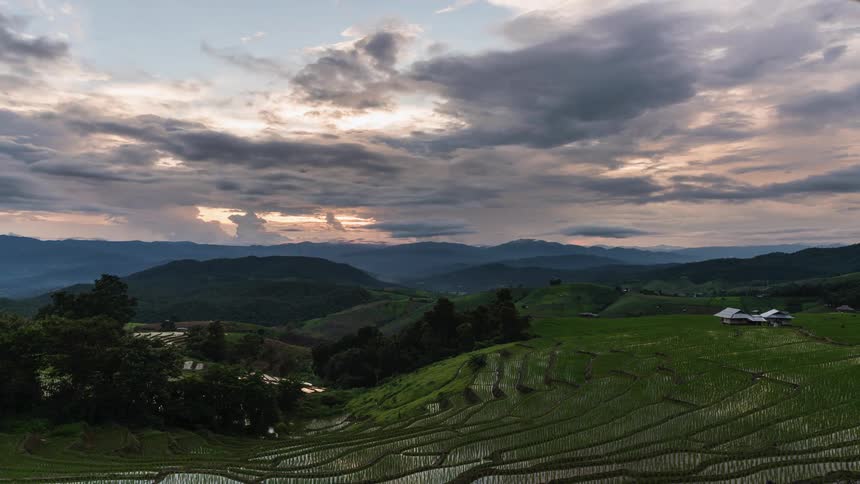 A view of hills with clouds above it