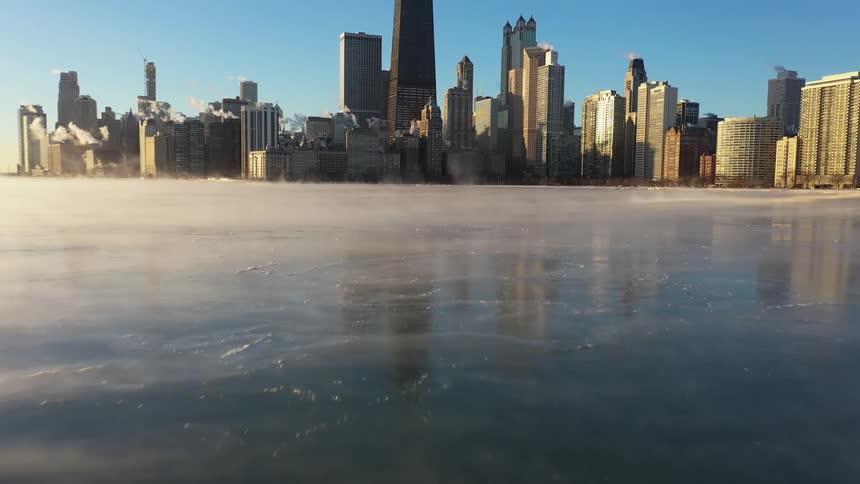Aerial view of a city skyline is displayed in winter