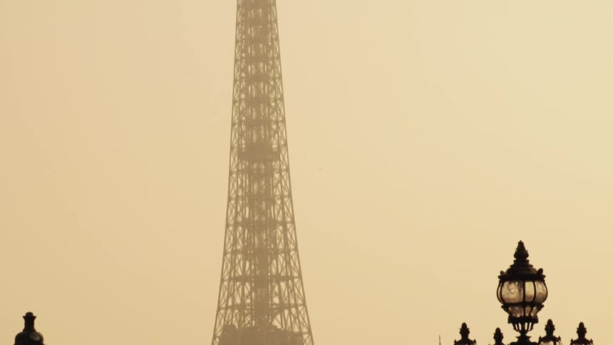 Heavy fog settles over the eiffel tower