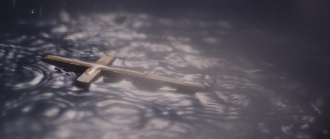 A cross is floating in the water