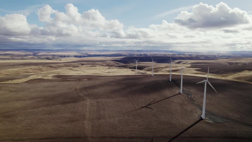 Aerial view of wind powered landscape is displayed