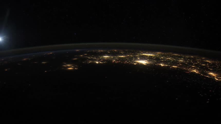 A view of space and planets is displayed on film