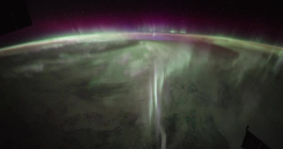 Time lapse of the shimmering polar lights moving in waves over planet earth seen from space