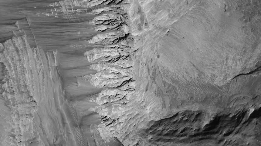 Pale terrain shows striations drop offs and rough patches