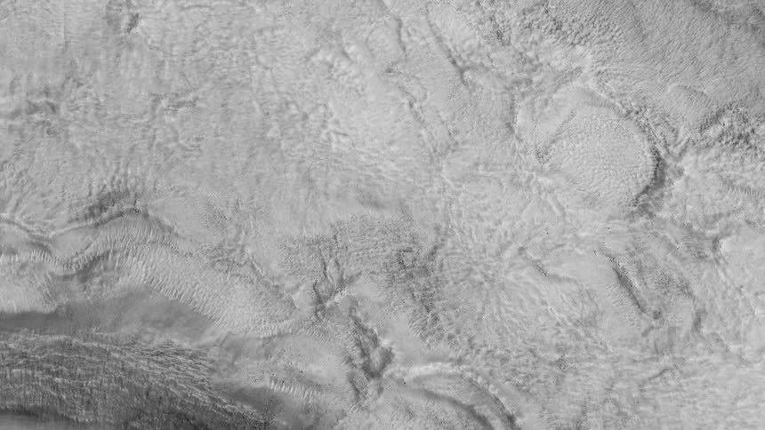 Textured white surface borders dark curved drop