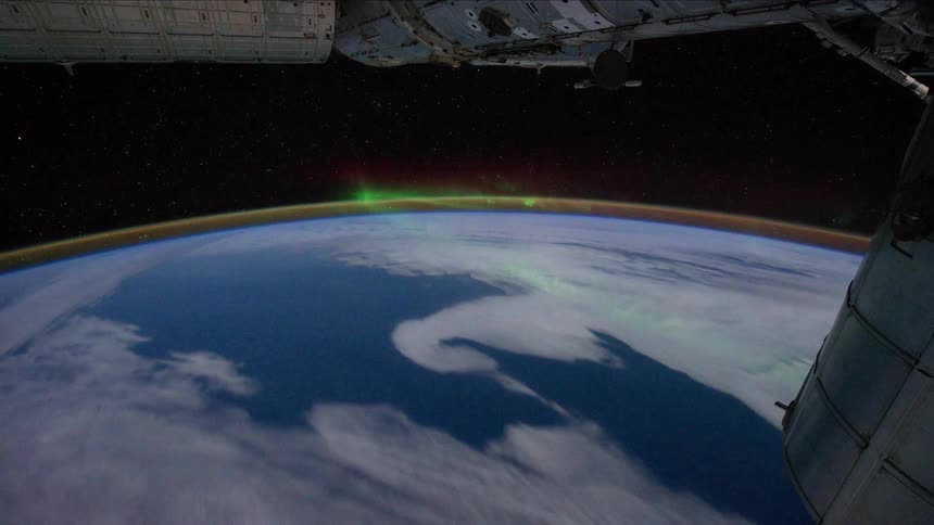 A satellite flying above the curved surface of the earth