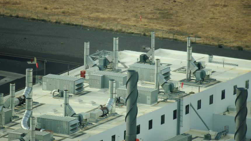 Dynamic aerial shot of a high tech carbon fiber manufacturing facility