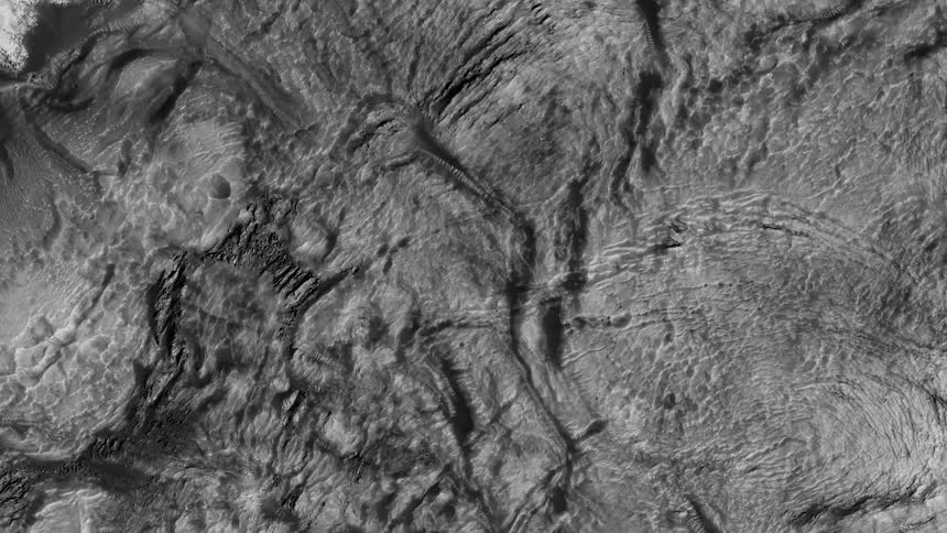 Monochrome landscape is filled with crevices and hills