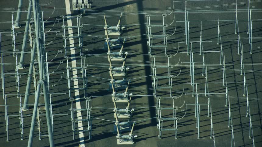 Aerial view of an electrical grid substation and high tension power transformers