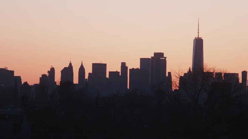 Aerial view of new york city skyline from a distance with skyscrapers and many tall buildings on the horizon