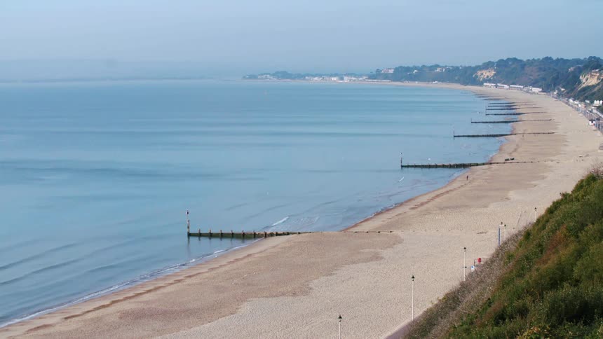 The view is of the beach and you can see the ocean
