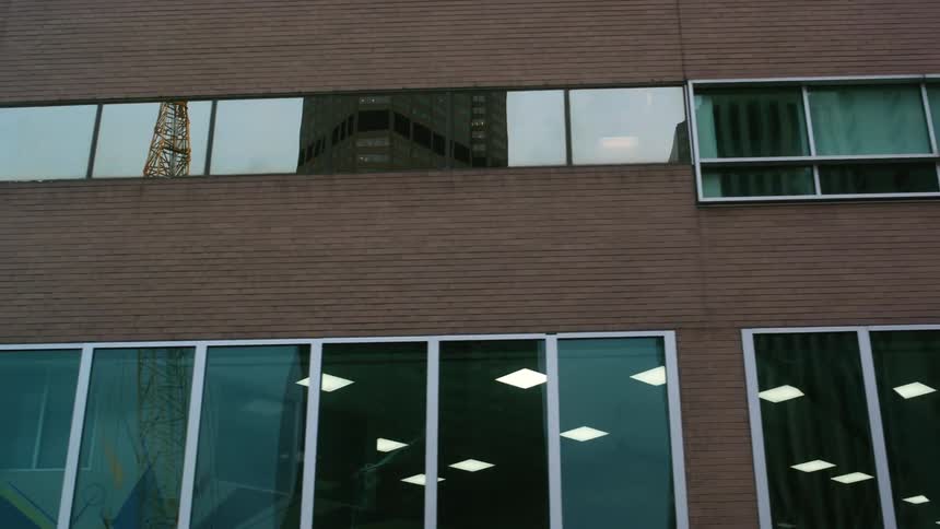 Buildings reflect on the windows