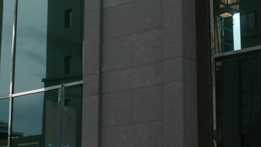 Close up view of windows in a downtown city is displayed