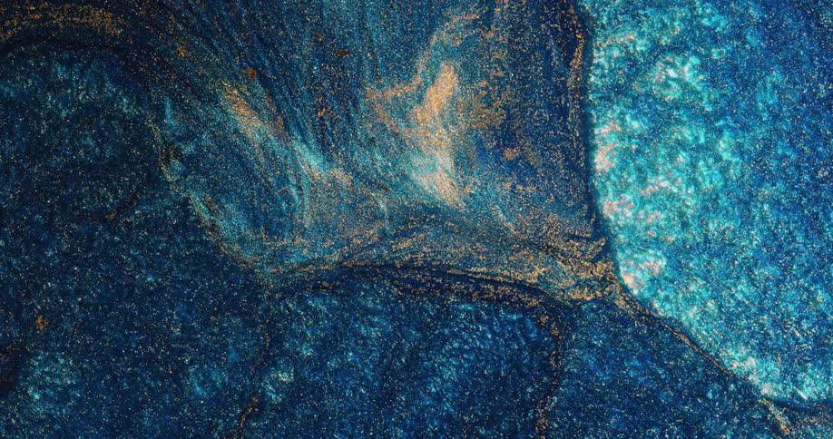 A blue liquid is moving towards bubbles of other colors