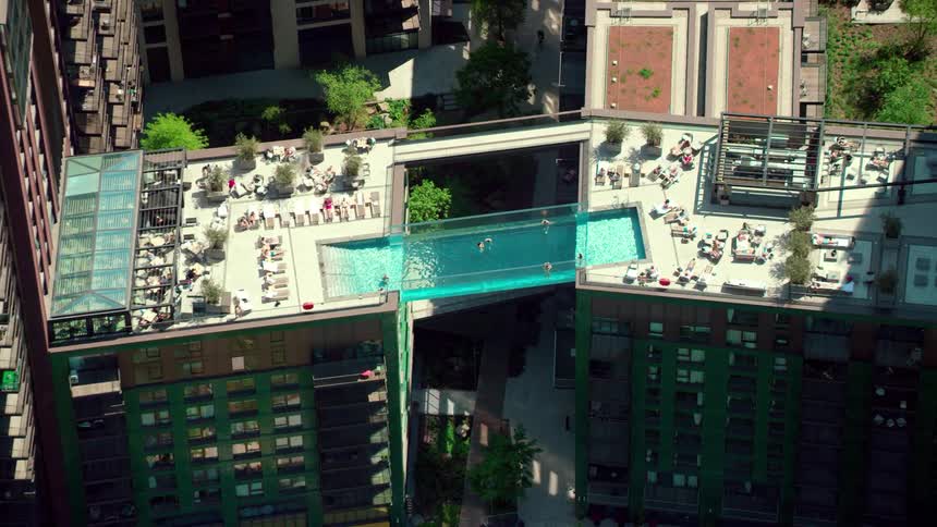 Aerial view oftwo buildings with a pool connecting them