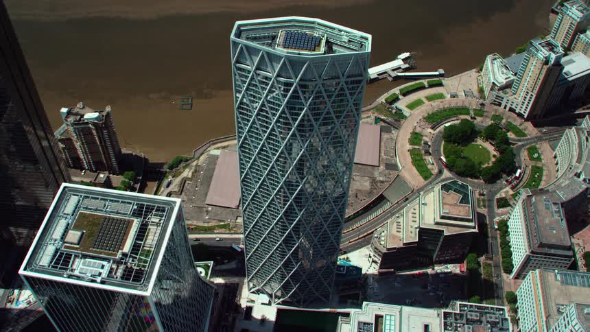 Aerial view of blue skyscraper in the city near water