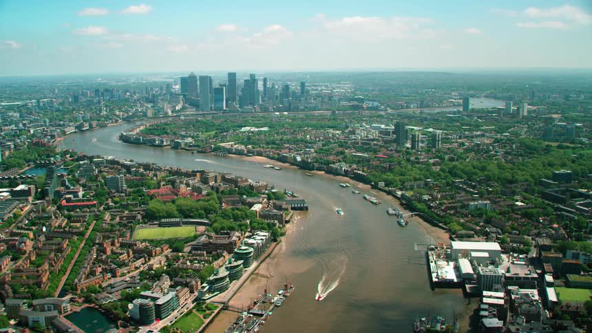 Aerial view of river thames with boats and skyline in london