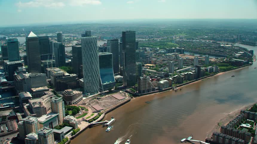Aerial view of skyscrapers high rise buildings and streets and neighborhoods next to the river in the city