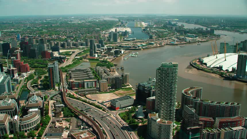 A large city near a river with many roads in the city