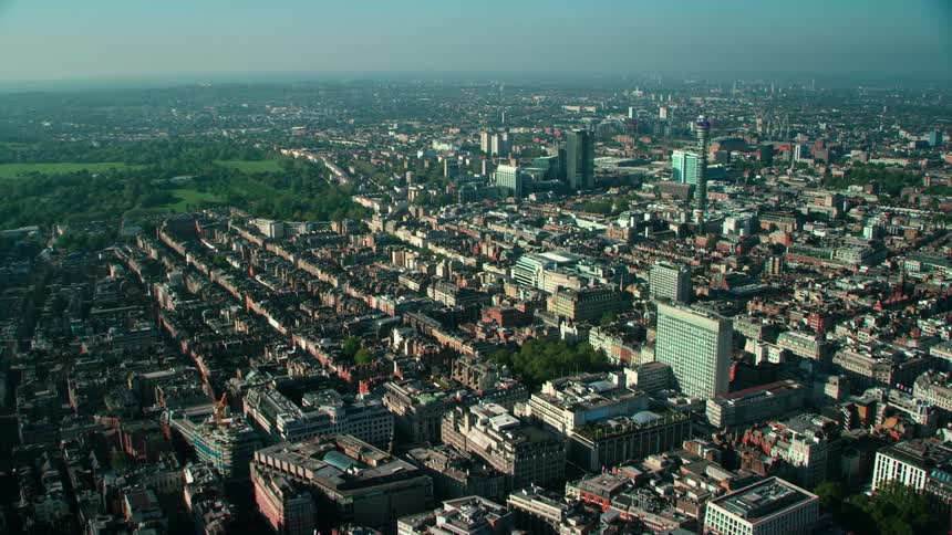 Aerial view ofcity streets and neighborhoods with buildings in the city