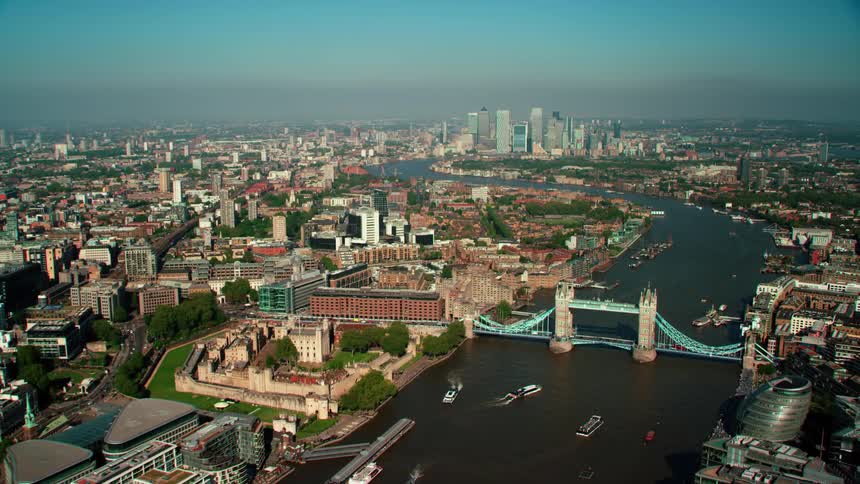 Aerial view of the thames river winding through the city of london at daytime