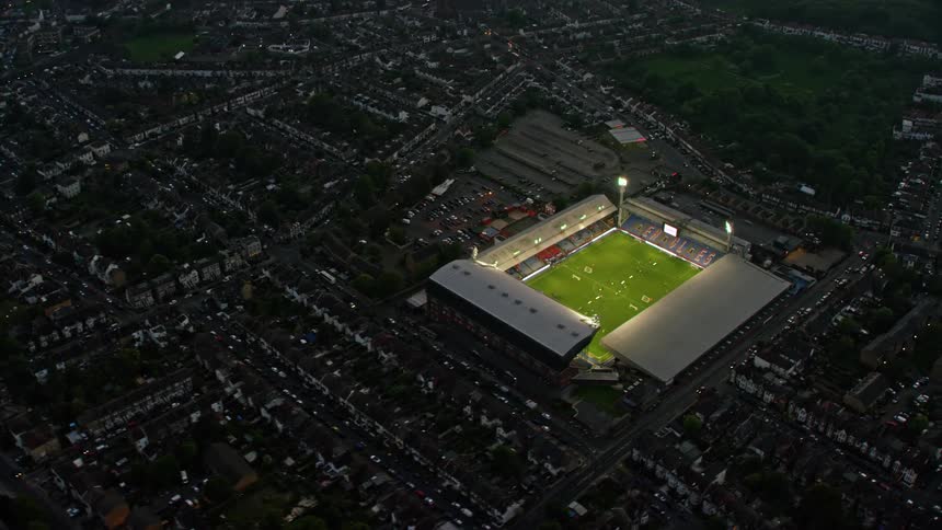 An aerial view of a sports arena in a city