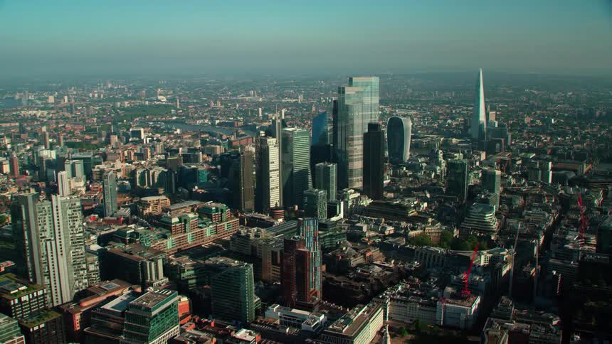 Skyscrapers loom over a metropolis during the day