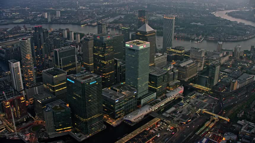 Aerial view of a city with many tall buildings and a river nearby