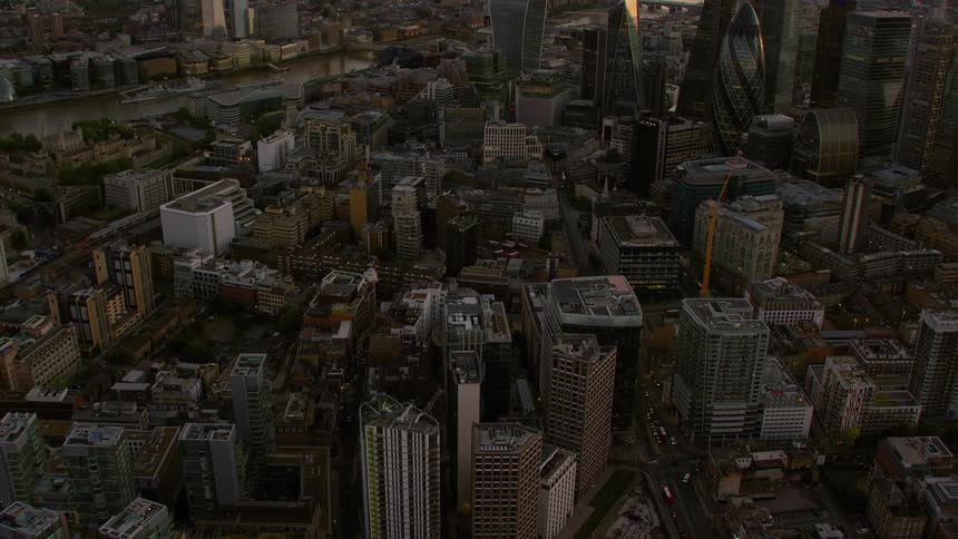 Skyscrapers tower over apartment buildings in a dense city