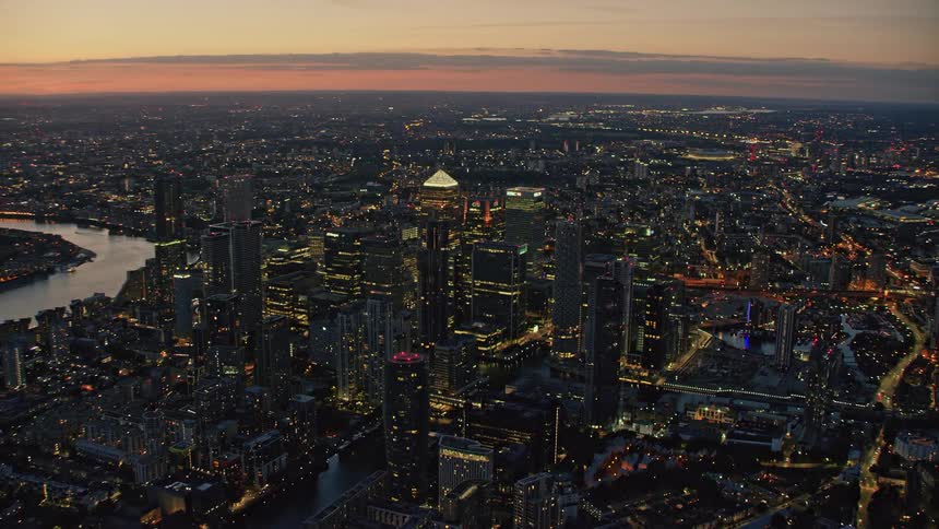 An aerial view of a city at sunset
