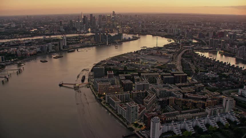Aerial view of river thames buildings and skyline of london at sunset