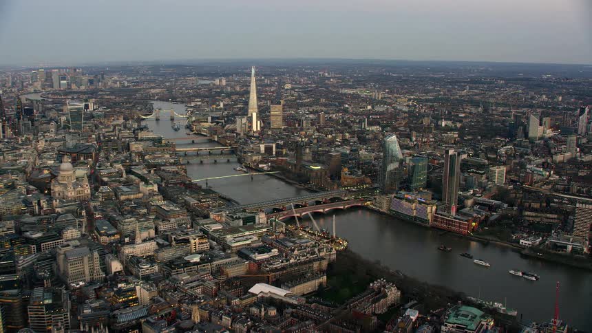 Aerial view of river thames with boats and skyline in london