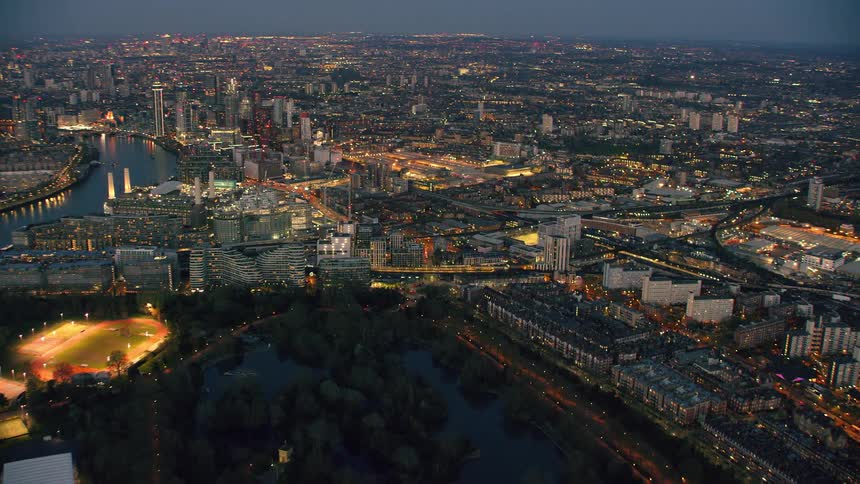 A vast metropolitan cityscape at night