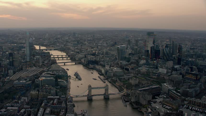 Aerial view of a city is displayed during sunset