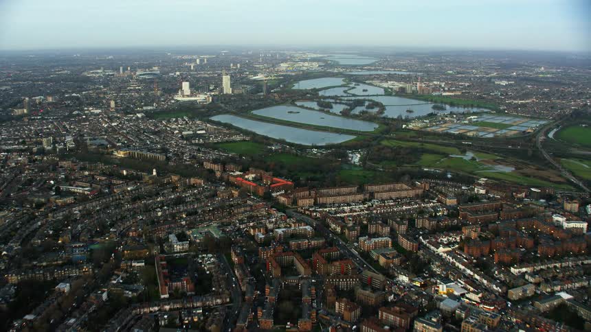 A city is seen down from below with its major centers and lake in view