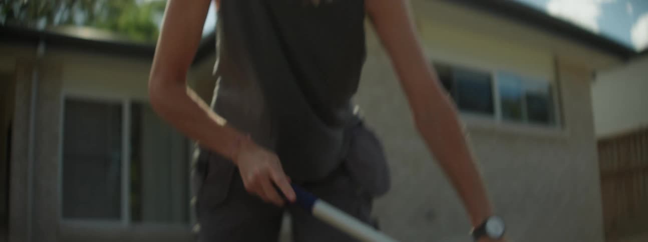A woman working on her yard