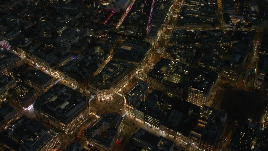 A large intersection in a metropolis at night