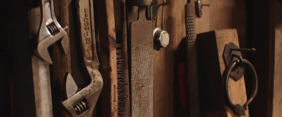 Tools hanging on a wall indoors