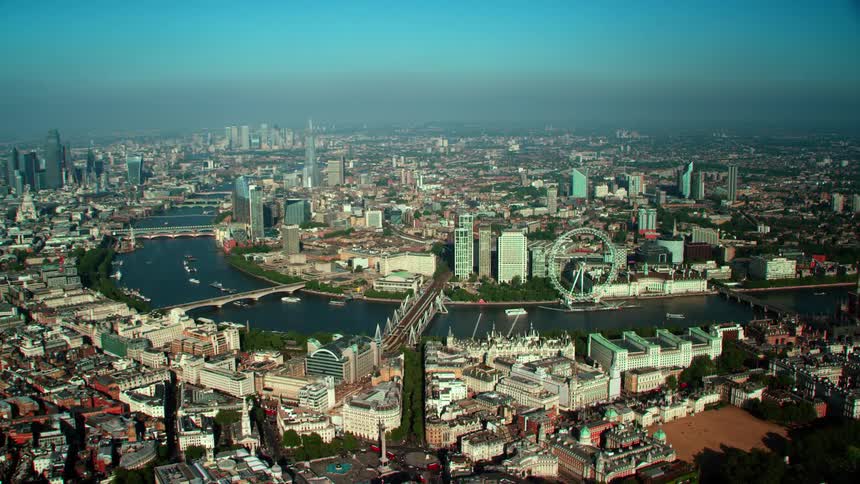 A bend in a river splitting a metropolis during the day